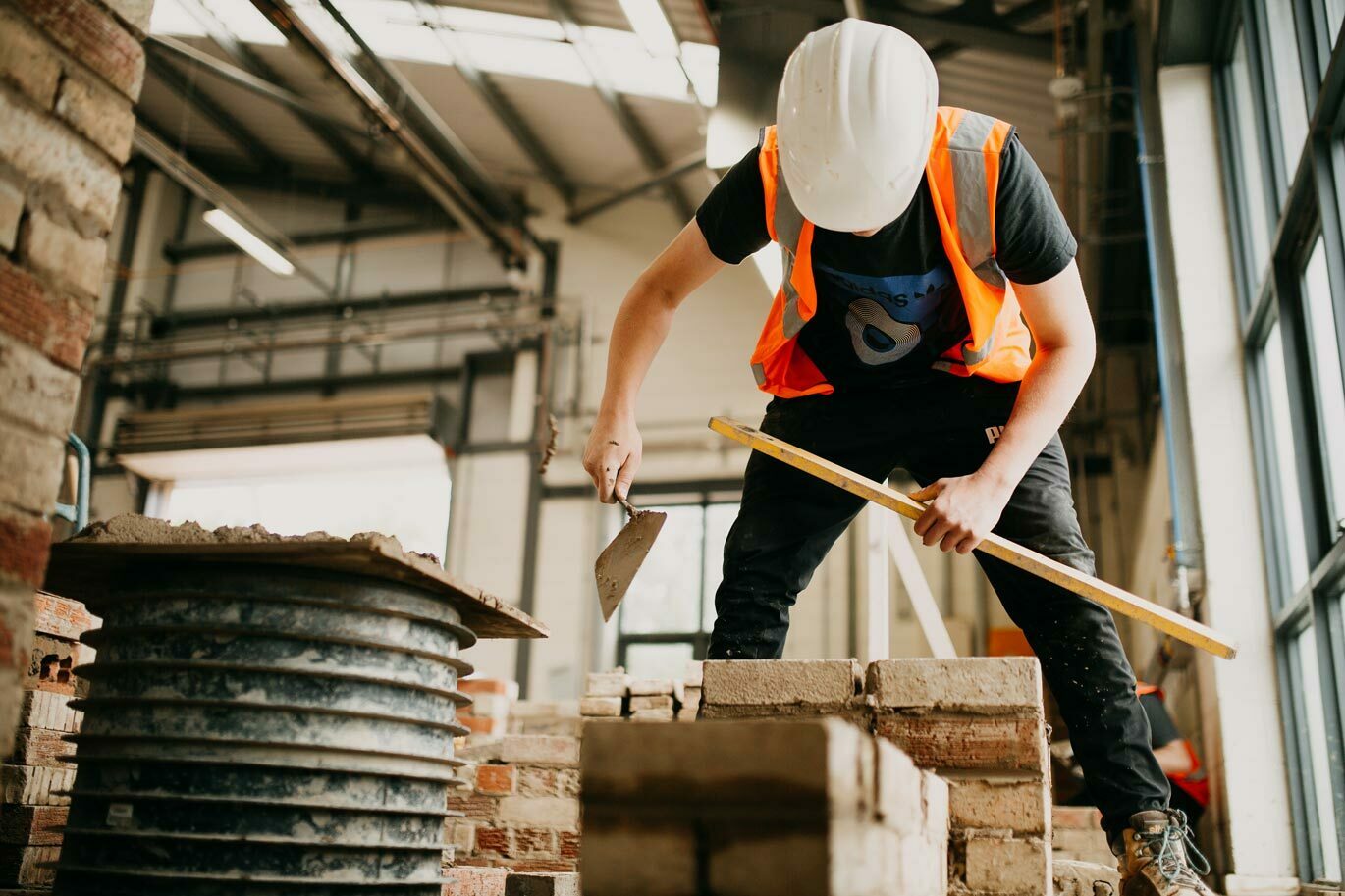 Bricklaying course student working